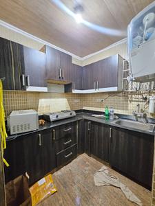 Kitchen Image of 1000 Sq.ft 2 BHK Builder Floor for rent in Star Apartment, Chhattarpur New Delhi for Rs. 26000
