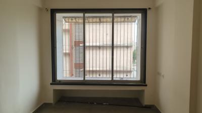 Bedroom Image of 630 Sq.ft 1 BHK Apartment / Flat for sale in Happy Sarvodaya Trilok, Thakurli Thane for Rs. 4500000