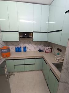 Kitchen Image of 950 Sq.ft 2 BHK Builder Floor for rent in Ramesh Nagar New Delhi for Rs. 28000