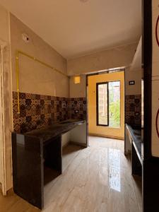 Kitchen Image of 810 Sq.ft 2 BHK Apartment / Flat for sale in M K Shivam Paradise Phase I, Badlapur West Badlapur for Rs. 3750000