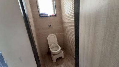 Bathroom Image of 615 Sq.ft 1 BHK Apartment / Flat for sale in Saakshi Parvatara, Kiwale Pune for Rs. 5500000