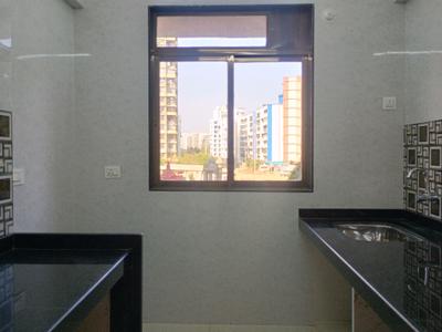 Kitchen Image of 650 Sq.ft 1 BHK Apartment / Flat for sale in Tharwani Vedant Millenia, Titwala Thane for Rs. 3199000