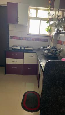 Kitchen Image of 550 Sq.ft 1 BHK Apartment / Flat for rent in Triaa Punyavaastu, Charholi Budruk Pune for Rs. 20000