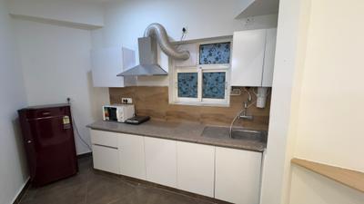 Kitchen Image of 714 Sq.ft 1 BHK Apartment / Flat for sale in Nimbus The Golden Palms Tower O, Sector 168 Noida for Rs. 8300000