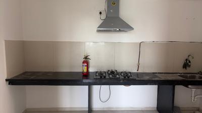 Kitchen Image of 900 Sq.ft 2 BHK Apartment / Flat for rent in Pride Kingsbury Phase I, Charholi Budruk Pune for Rs. 26000
