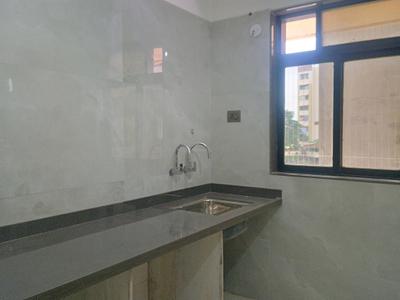 Kitchen Image of 710 Sq.ft 1 BHK Apartment / Flat for sale in Mohan Precious Greens Phase II, Ambernath East Ambernath for Rs. 3499000