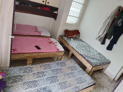 Bedroom Image of Kalyan pg,2nd floor Parthasarathi apartment  in Thaltej, Ahmedabad