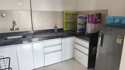 Kitchen Image of 700 Sq.ft 1 BHK Apartment / Flat for rent in Ajax Global Lifestyle Kharadi, Kharadi Pune for Rs. 30000