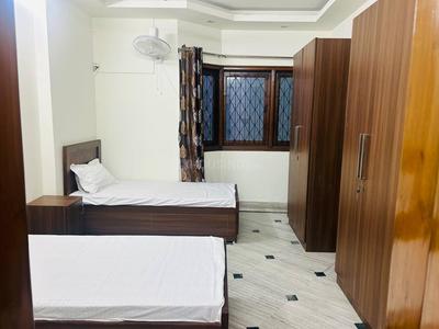 Bedroom Image of R.K. PG in Kotla Mubarakpur, New Delhi