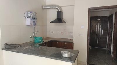 Kitchen Image of 795 Sq.ft 1 BHK Apartment / Flat for rent in Cosmos Express 99, Sector 99 Gurgaon for Rs. 21000