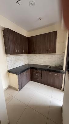 Kitchen Image of 950 Sq.ft 2 BHK Apartment / Flat for rent in Charms Castle, Raj Nagar Extension Ghaziabad for Rs. 15000