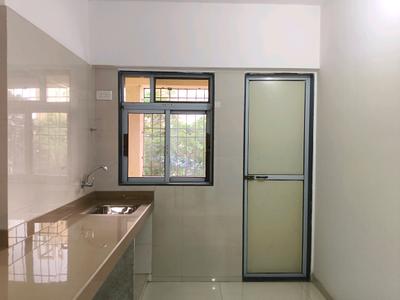 Kitchen Image of 616 Sq.ft 1 BHK Apartment / Flat for sale in Cosmos Meluha, Khidkali Thane for Rs. 4700000