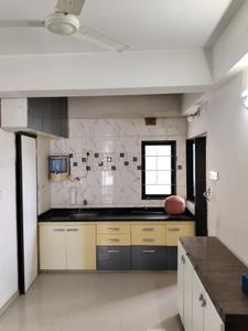 Kitchen Image of 1080 Sq.ft 2 BHK Apartment / Flat for rent in Swastik Divine, Science City Ahmedabad for Rs. 25000
