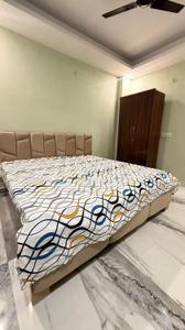 Bedroom Image of 950 Sq.ft 2 BHK Builder Floor for rent in Khirki Extension New Delhi for Rs. 32000