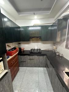 Kitchen Image of 972 Sq.ft 2 BHK Apartment / Flat for rent in Charms Castle, Raj Nagar Extension Ghaziabad for Rs. 17000