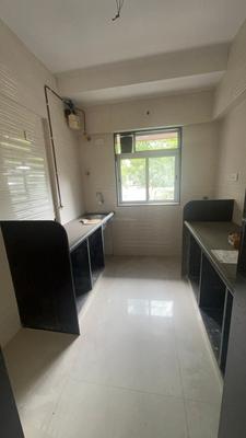 Kitchen Image of 800 Sq.ft 2 BHK Apartment / Flat for sale in Glasswood Om Sarjan CHSL, Borivali West Mumbai for Rs. 19500000