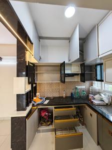 Kitchen Image of 601 Sq.ft 1 BHK Apartment / Flat for rent in Olympia Opaline, Navalur Chennai for Rs. 29000