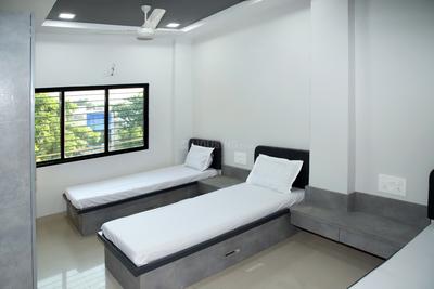Bedroom Image of Radhesh PG for Boys in Satellite, Ahmedabad