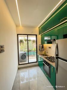 Kitchen Image of 650 Sq.ft 1 BHK Apartment / Flat for sale in Damat Thane for Rs. 2500000