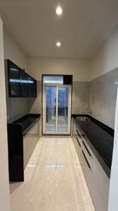 Kitchen Image of 900 Sq.ft 2 BHK Apartment / Flat for sale in Gajra Bhoomi Castle Phase I, Daighar Gaon Thane for Rs. 6700000