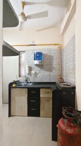 Kitchen Image of 910 Sq.ft 1 BHK Apartment / Flat for rent in Makarba Ahmedabad for Rs. 22000