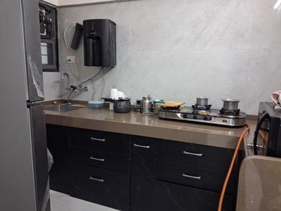 Kitchen Image of 1003 Sq.ft 2 BHK Apartment / Flat for rent in Ten United Athashri, Lohegaon Pune for Rs. 23000