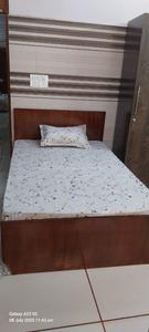 Bedroom Image of Sharma PG in Shahdara, New Delhi