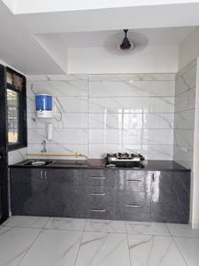Kitchen Image of 824 Sq.ft 3 BHK Apartment / Flat for sale in Ashwamegh Elite, Sargasan Gandhinagar for Rs. 7900000