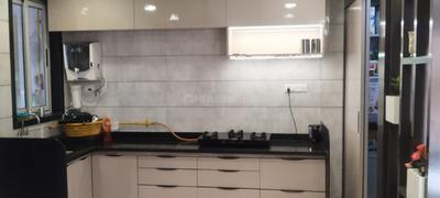 Kitchen Image of 1350 Sq.ft 2 BHK Apartment / Flat for sale in Dhanush Buildcon Canal Walk Shoppers Sanctum Celino, Vesu Surat for Rs. 5500000