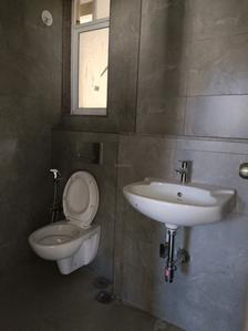 Common Bathroom Image of 550 Sq.ft 1 BHK Apartment / Flat for rent in Godrej Nest, Kandivali East Mumbai for Rs. 34000