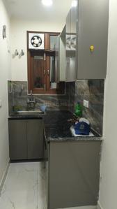Kitchen Image of 450 Sq.ft 1 BHK Builder Floor for rent in ATFL JVTS Gardens, Chhattarpur New Delhi for Rs. 13000