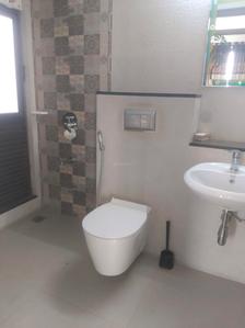 Common Bathroom Image of 800 Sq.ft 2 BHK Apartment / Flat for sale in Mahindra Roots, Kandivali East Mumbai for Rs. 17900000