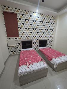 Bedroom Image of Ganesh Living PG in Sector 28, Gurgaon
