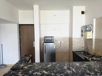 Kitchen Image of 639 Sq.ft 1 BHK Studio for rent in Lodha Belmondo, Gahunje Pune for Rs. 28000