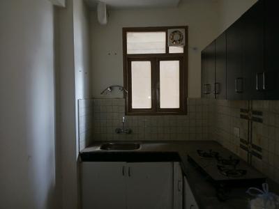 Kitchen Image of 800 Sq.ft 2 BHK Apartment / Flat for sale in Pareena Om Apartments by Pareena Infrastructure Builders, Sector 112 Gurgaon for Rs. 6300000