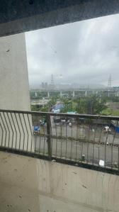 Balcony Image of 900 Sq.ft 2 BHK Apartment / Flat for rent in Palm Vista A1 &amp; A2, Shilphata Thane for Rs. 22000