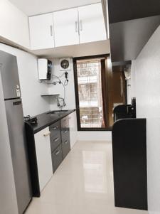 Kitchen Image of 980 Sq.ft 2 BHK Apartment / Flat for sale in Unique Aurum, Mira Road East Mira Bhayandar for Rs. 13200000