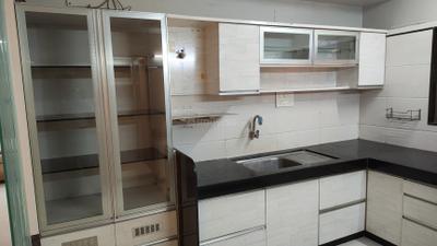Kitchen Image of 1970 Sq.ft 3 BHK Apartment / Flat for sale in Raghuvir Shyam Palace, Vesu Surat for Rs. 13500000