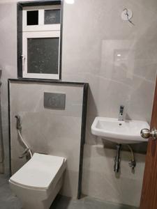 Common Bathroom Image of 690 Sq.ft 1 BHK Apartment / Flat for sale in Stark K Raheja Residency, Malad East Mumbai for Rs. 16000000