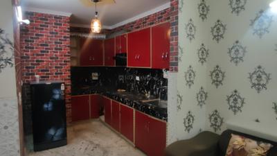 Kitchen Image of 580 Sq.ft 1 BHK Builder Floor for rent in Dwarka Mor New Delhi for Rs. 16000