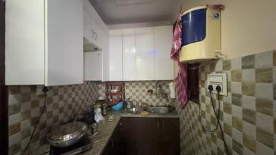 Kitchen Image of 700 Sq.ft 1 BHK Builder Floor for rent in Sector 57 Gurgaon for Rs. 18000