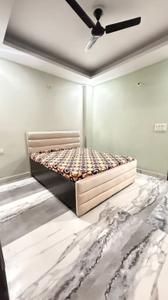 Bedroom Image of 950 Sq.ft 2 BHK Builder Floor for rent in Khirki Extension New Delhi for Rs. 32000