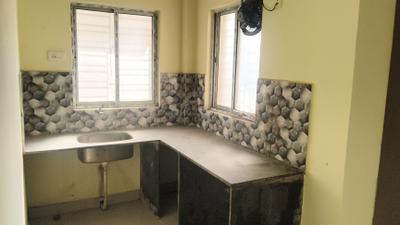 Kitchen Image of 600 Sq.ft 2 BHK Apartment / Flat for sale in Dharitri New Royal Enclave, New Town Kolkata for Rs. 3100000