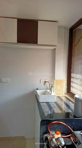 Kitchen Image of 810 Sq.ft 1 BHK Apartment / Flat for rent in Sargasan Gandhinagar for Rs. 22000