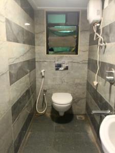 Common Bathroom Image of 1051 Sq.ft 2 BHK Apartment / Flat for sale in Tanvi Eminence, Mira Road East Mira Bhayandar for Rs. 9900000