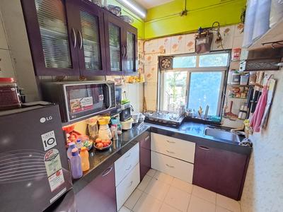 Kitchen Image of 950 Sq.ft 2 BHK Apartment / Flat for sale in Gharkul Complex, Kharghar Navi Mumbai for Rs. 8500000