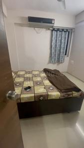 Bedroom Image of 990 Sq.ft 1 BHK Apartment / Flat for rent in LK Vrundavan Residency II, Sargasan Gandhinagar for Rs. 18500