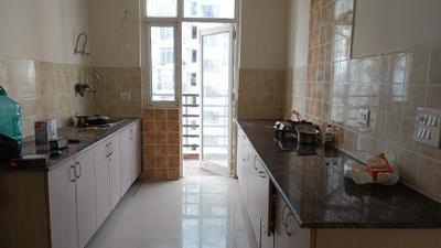 Kitchen Image of 1300 Sq.ft 3 BHK Apartment / Flat for rent in Gardenia Glory, Sector 46 Noida for Rs. 35000