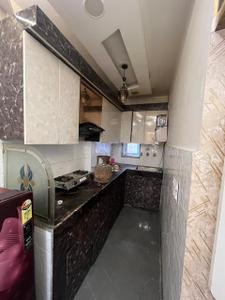 Kitchen Image of 700 Sq.ft 2 BHK Builder Floor for rent in Dwarka Mor New Delhi for Rs. 15500