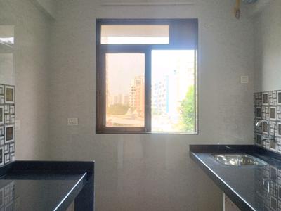 Kitchen Image of 616 Sq.ft 1 BHK Apartment / Flat for sale in Om Swayambhu Siddhivinayak Balaji Residency, Thakurli Thane for Rs. 4950000